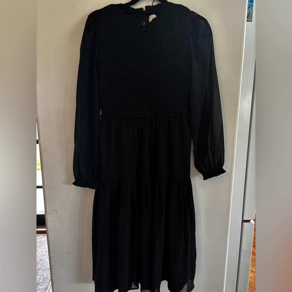 Elegant Black Long Sleeve Dress with ruching.